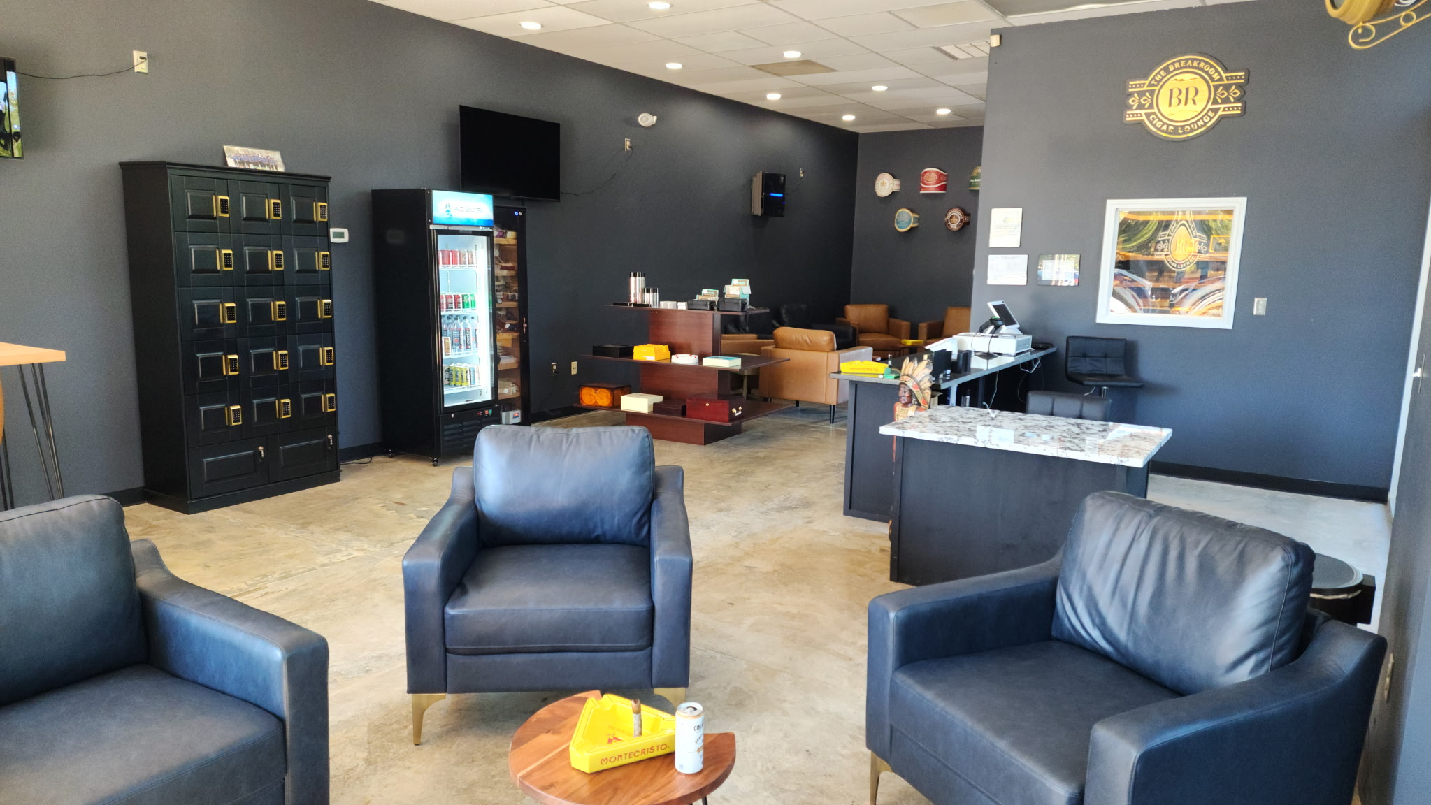 Relaxed lounge with leather seating and TVs